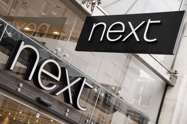 High street retailer Next has hiked its full-year profit forecast again after better than expected sales, despite unusually warm weather hitting demand for autumn ranges (PA)