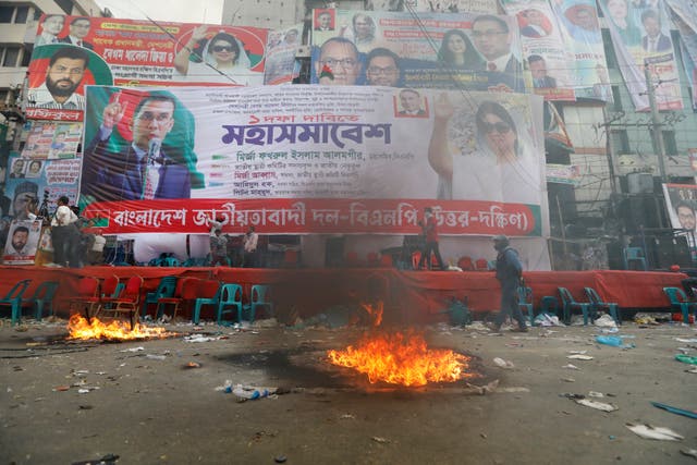 <p>Smoke rises from flames near the stage set for a protest by the Bangladesh Nationalist Party in Dhaka, Bangladesh on 28 October</p>
