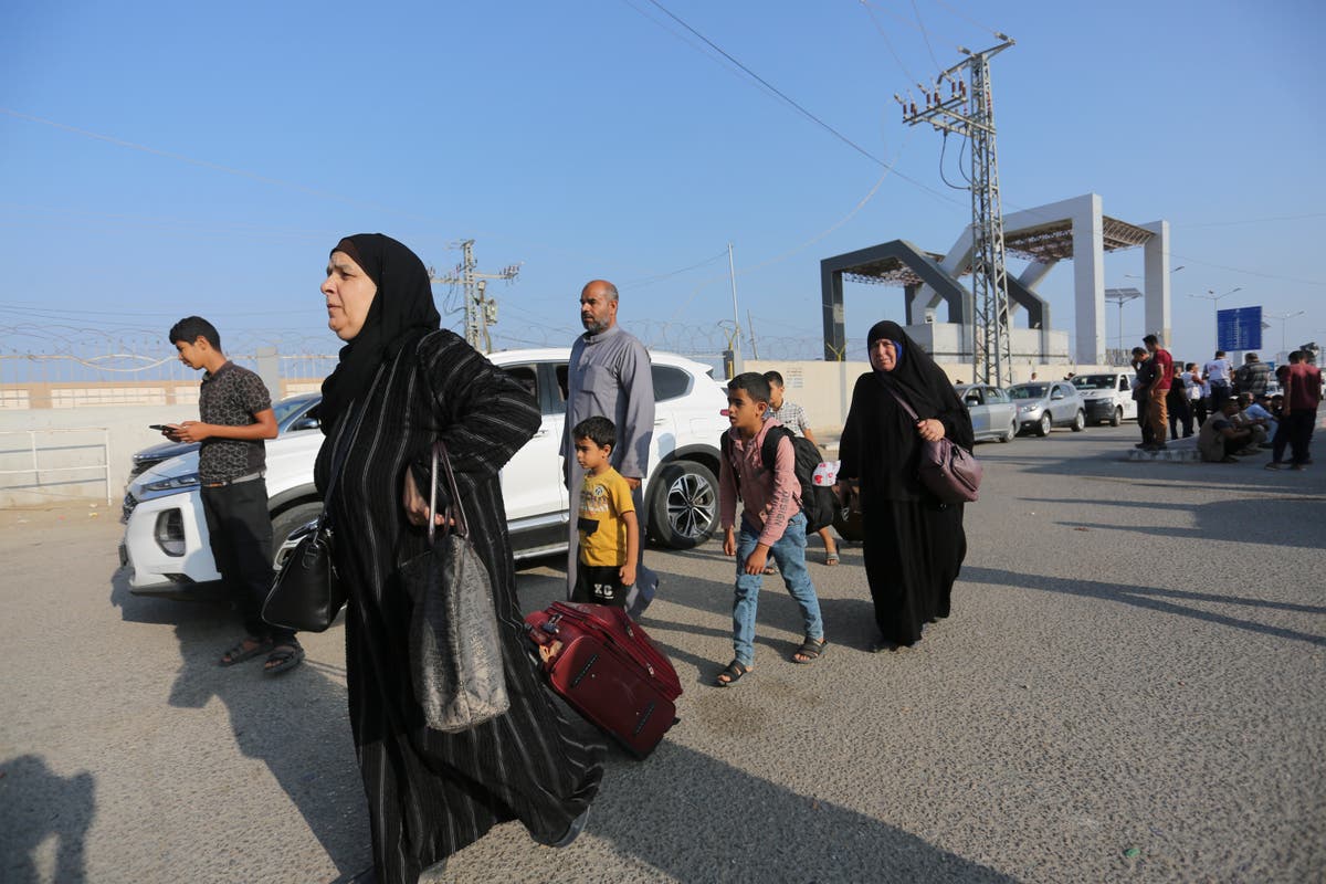 Hundreds fleeing Gaza gather at border as Egypt opens Rafah crossing ...