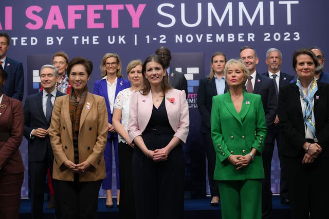 Technology Secretary Michelle Donelan (front row in pink jacket) is joined by international counterparts at the AI safety summit (Doug Peters/PA)
