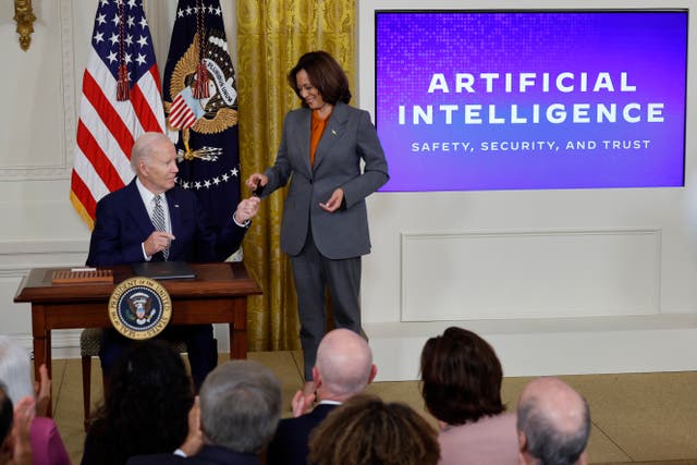 <p>U.S. President Joe Biden hands Vice President Kamala Harris the pen he used to sign a new executive order regarding artificial intelligence during an event in the East Room of the White House on October 30, 2023 in Washington, DC</p>