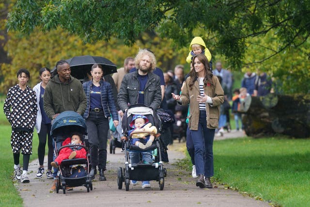 The Princess of Wales takes part in a ‘dad walk’ in the local park during a visit to Dadvengers, a community for fathers and their children (Yui Mok/PA)