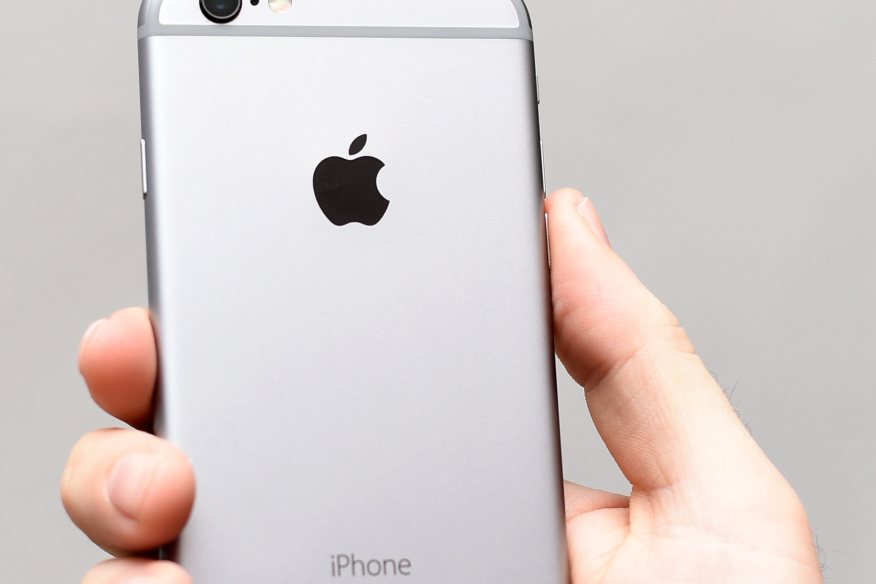 A generic stock photo of the back of a Space Grey Apple iPhone 6s.