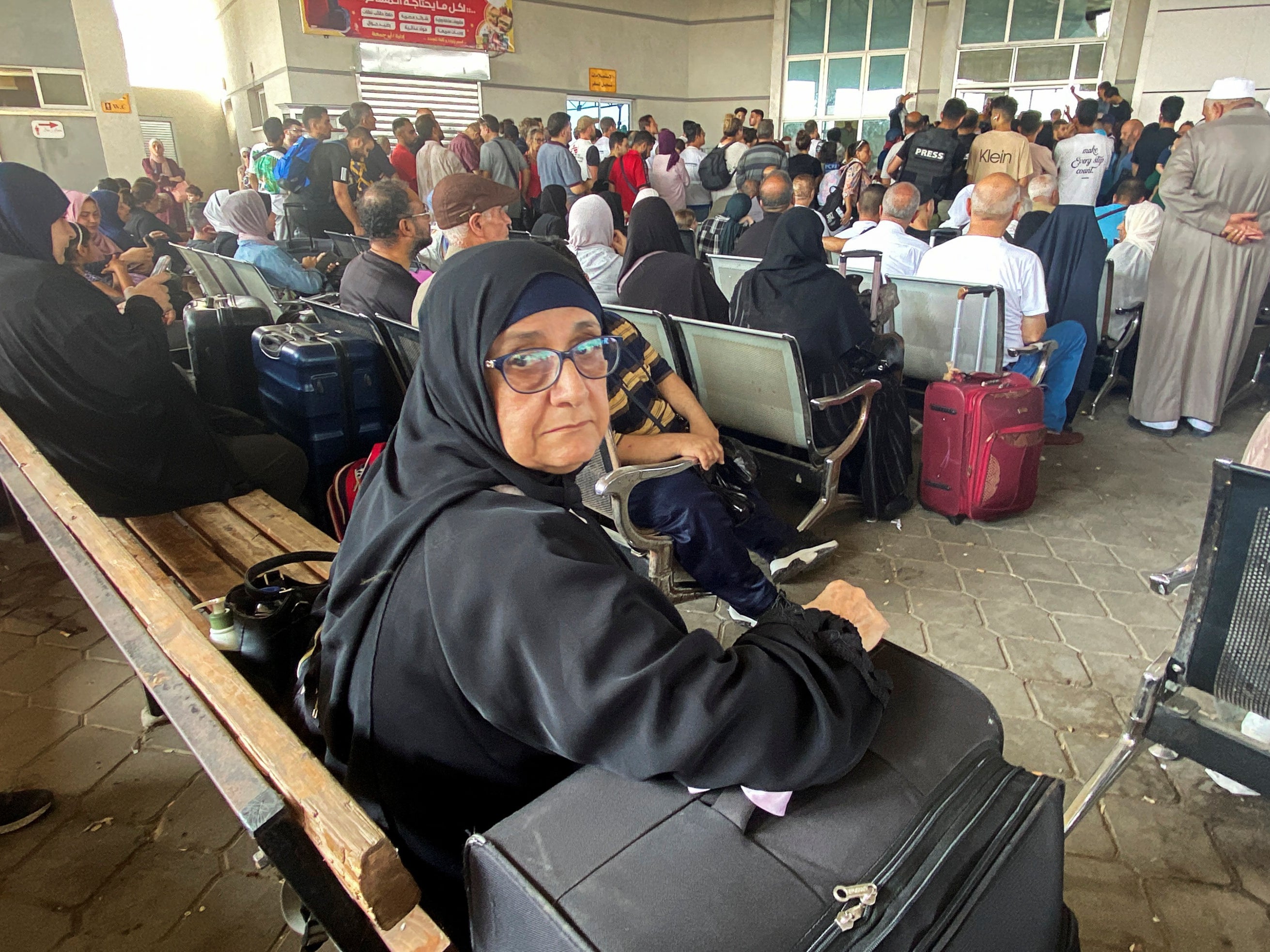 Palestinians with dual citizenship wait at the Rafah border crossing