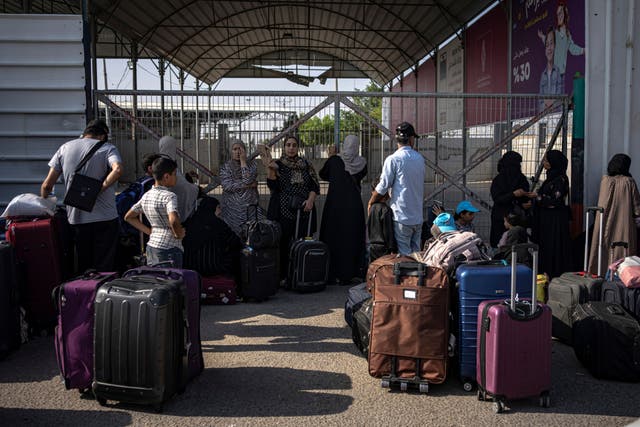 The UK is pushing for Britons trapped in the Gaza Strip to be allowed to leave after the border crossing with Egypt was opened (Fatima Shbair/AP)