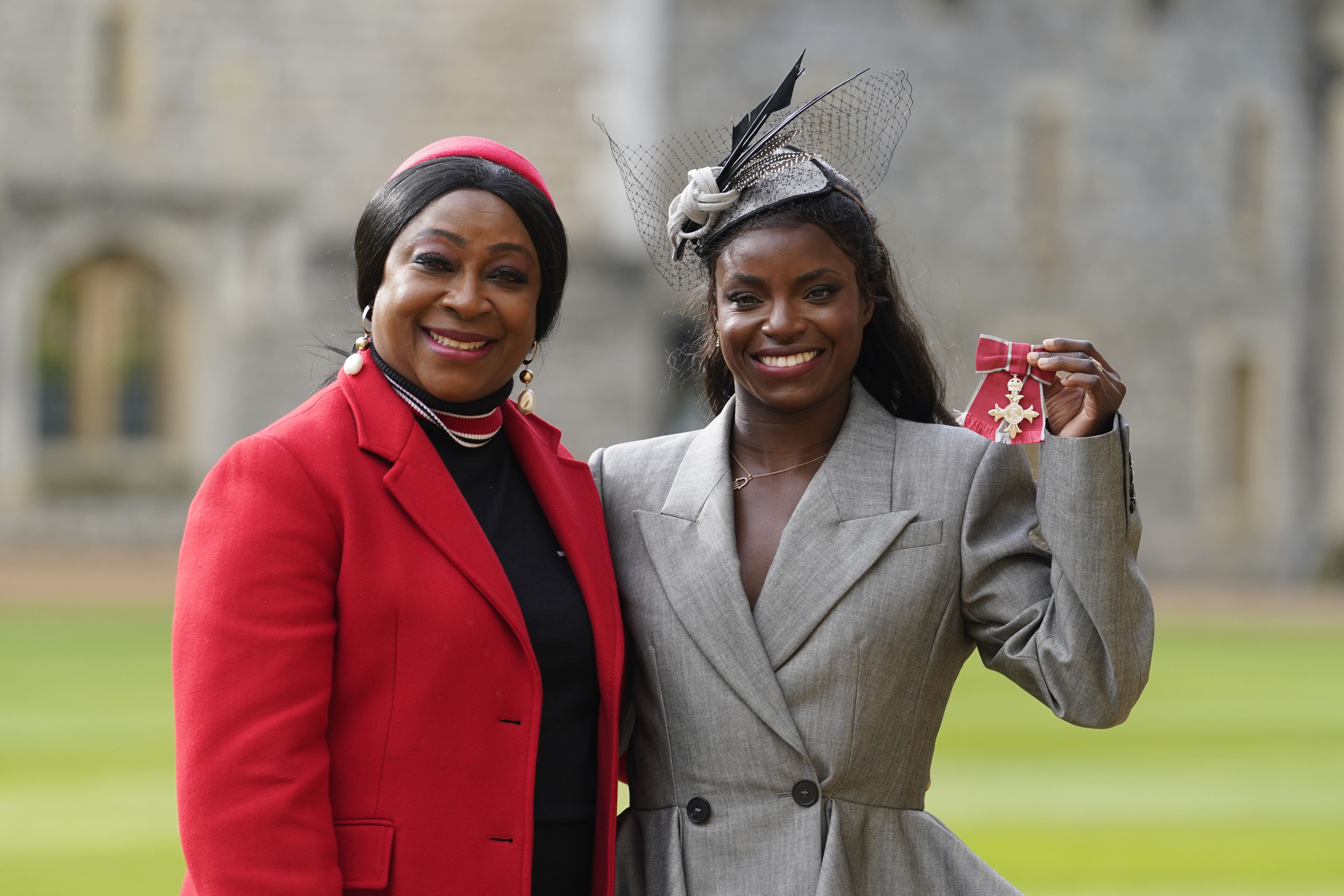 Eniola Aluko (right) poses for a photograph with her mother Sileola after being made an MBE (Andrew Matthews/PA)