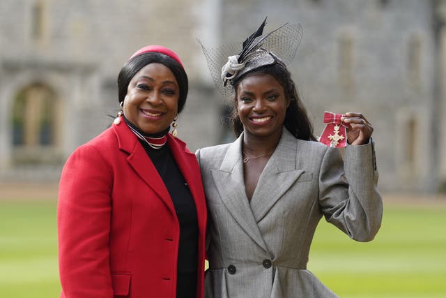 Eniola Aluko (right) poses for a photograph with her mother Sileola after being made an MBE (Andrew Matthews/PA)