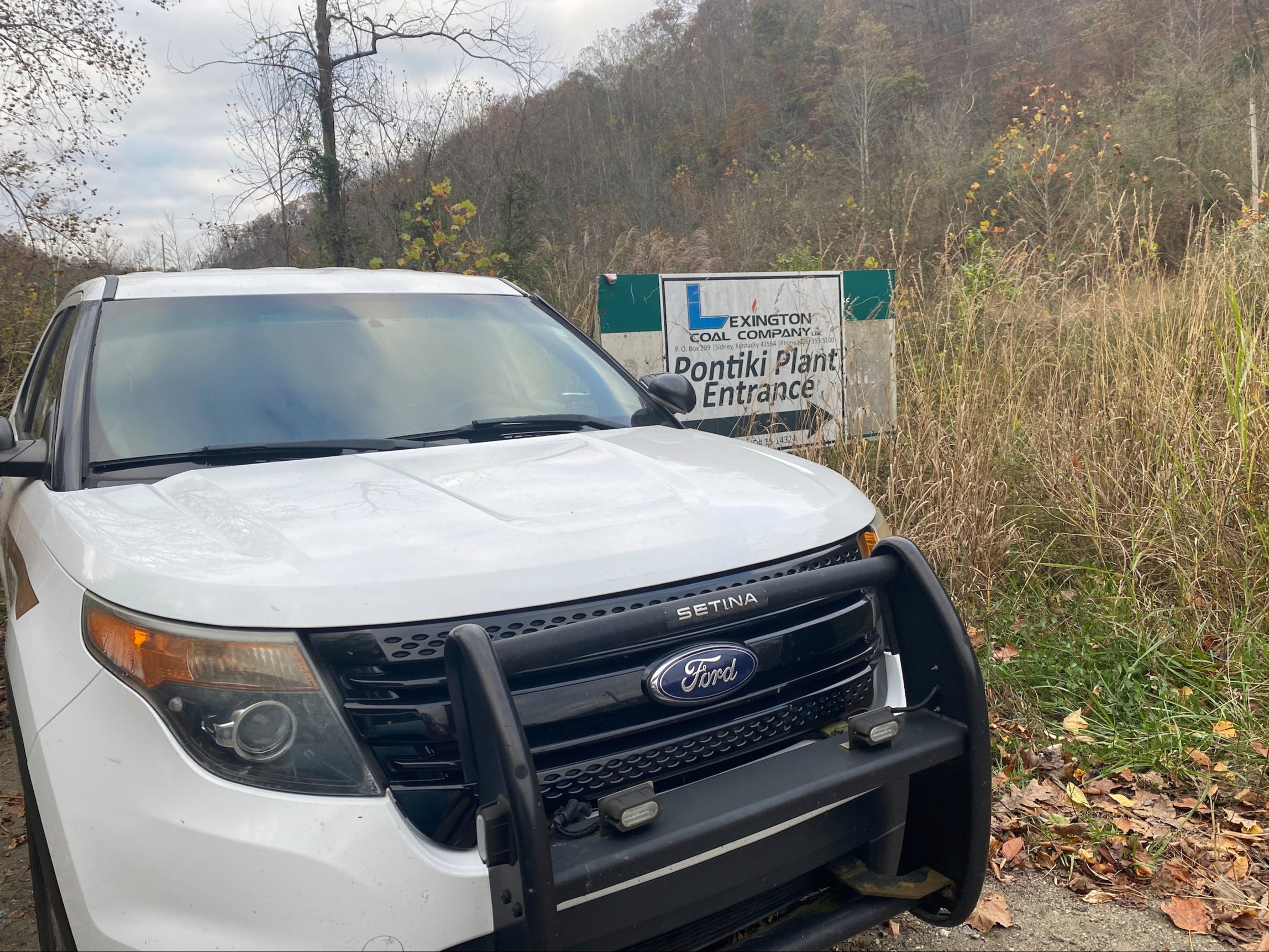 In this image provided by WCHS-TV, a Martin County, Ky., sheriff's cruiser is shown outside an abandoned mine coal preparation plant Wednesday, Nov. 1, 2023, south of Inez, Ky