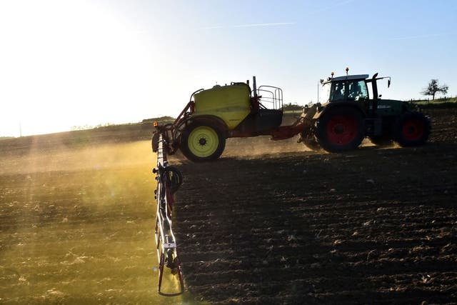 <p>A farmer sprays his fields with herbicides</p>