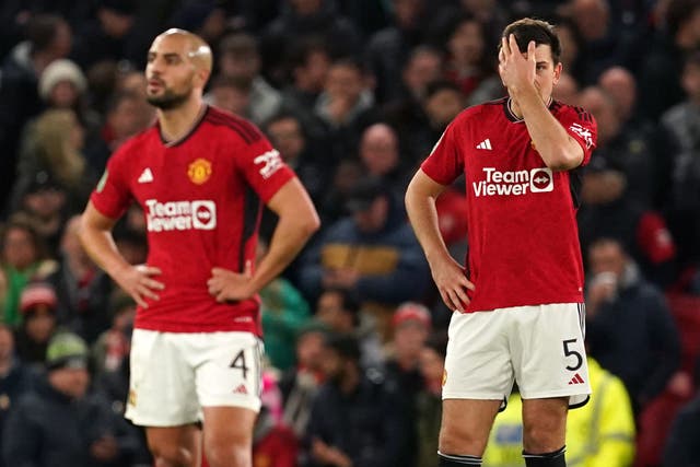 Manchester United’s Sofyan Amrabat and Harry Maguire (right) react after Newcastle go 3-0 up at Old Trafford (Martin Rickett/PA)