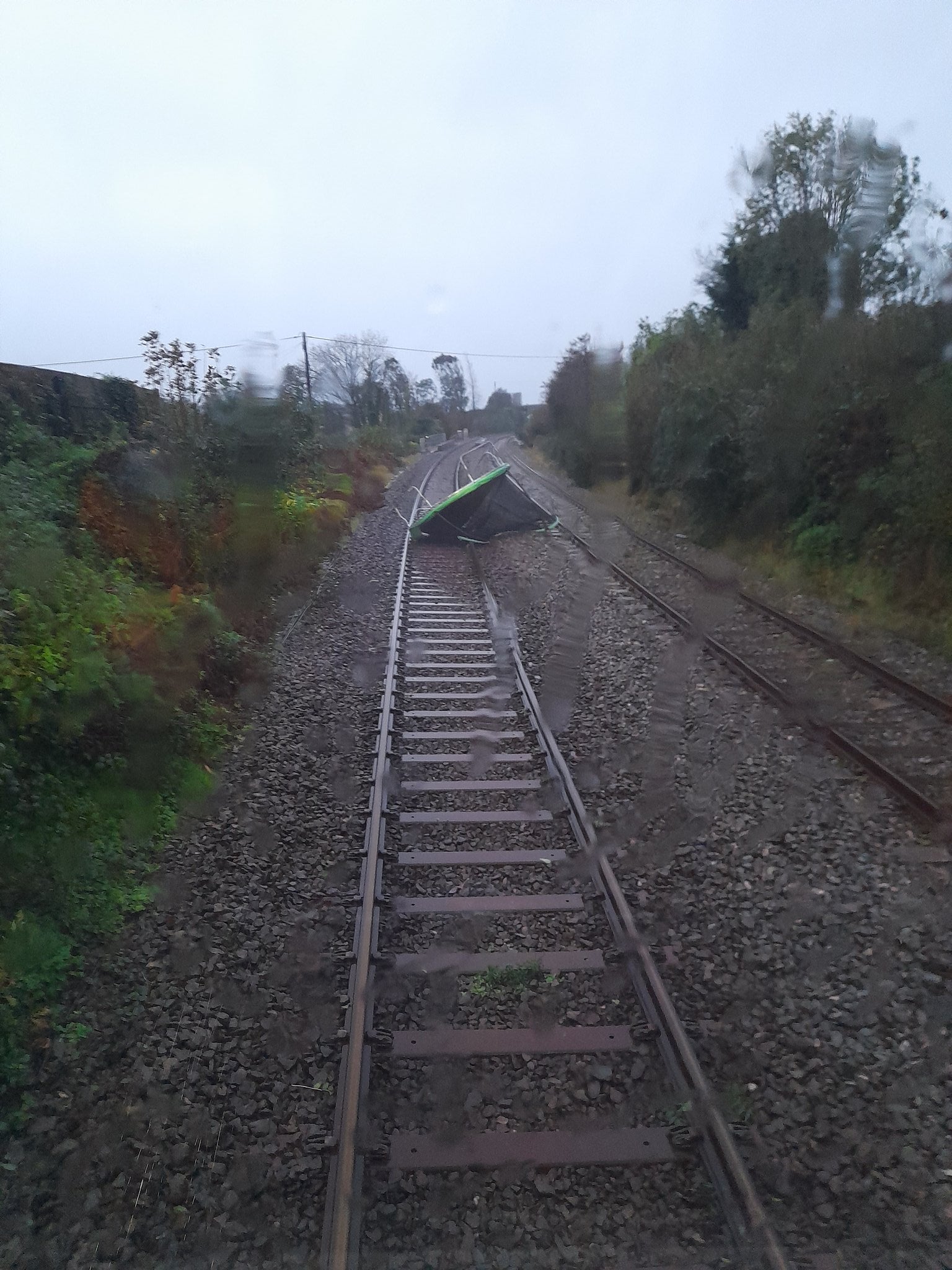 Handout photo issued by Network Rail Scotland of a large trampoline that blew onto the line at Livingston South. Storm Jocelyn has brought fresh travel disruption to much of the UK, less than two days after Storm Isha left two people dead and thousands without power.