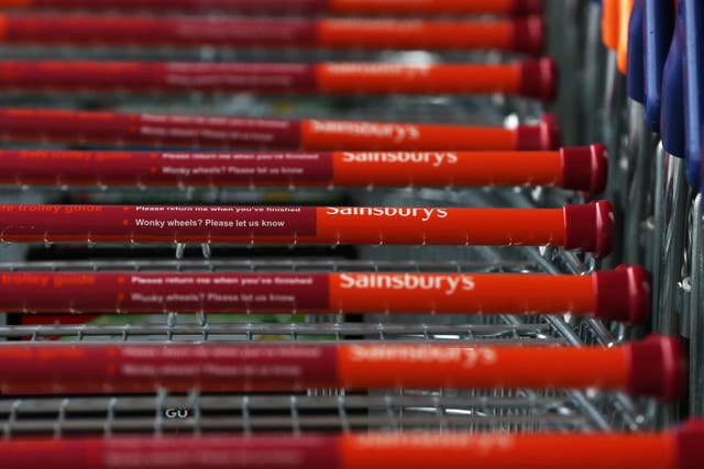 Supermarket Sainsbury’s has upped its annual earnings outlook as it said it was claiming market share from German discounters Aldi and Lidl thanks to soaring grocery sales (PA)
