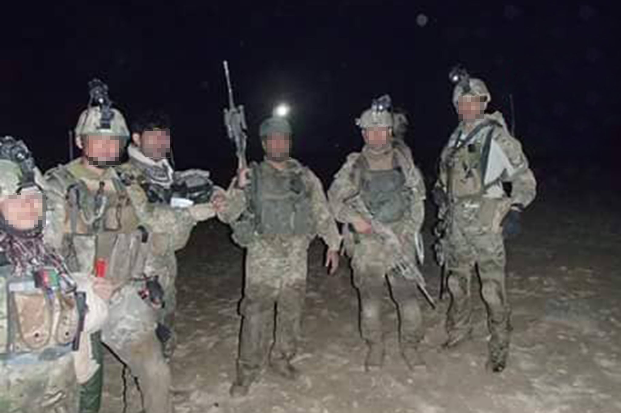 Rahmatullah (far right) during his time in the Afghan special forces