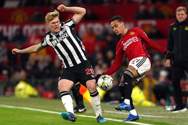 Lewis Hall helped Newcastle to victory at Manchester United (Martin Rickett/PA)