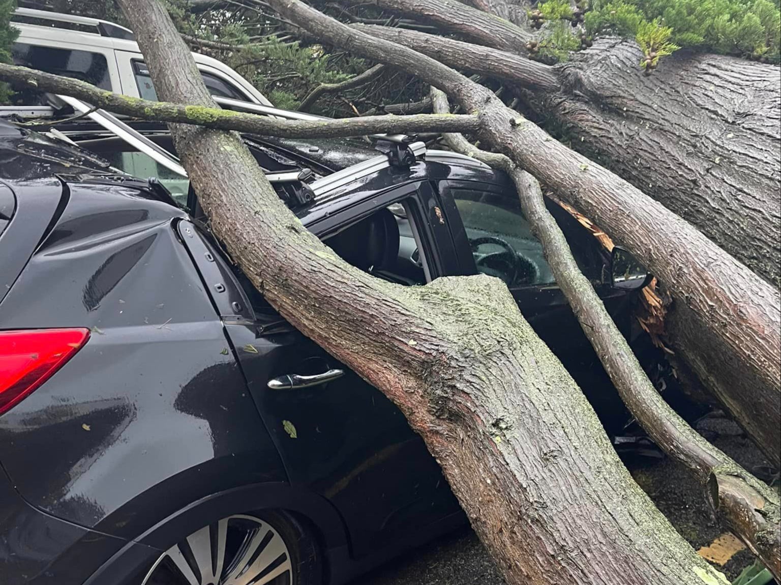 Cars, homes and buildings have been damaged as the storm hits the UK
