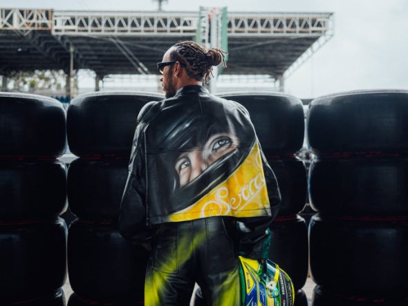 Lewis Hamilton wearing a Senna-inspired jacket in Interlagos last year
