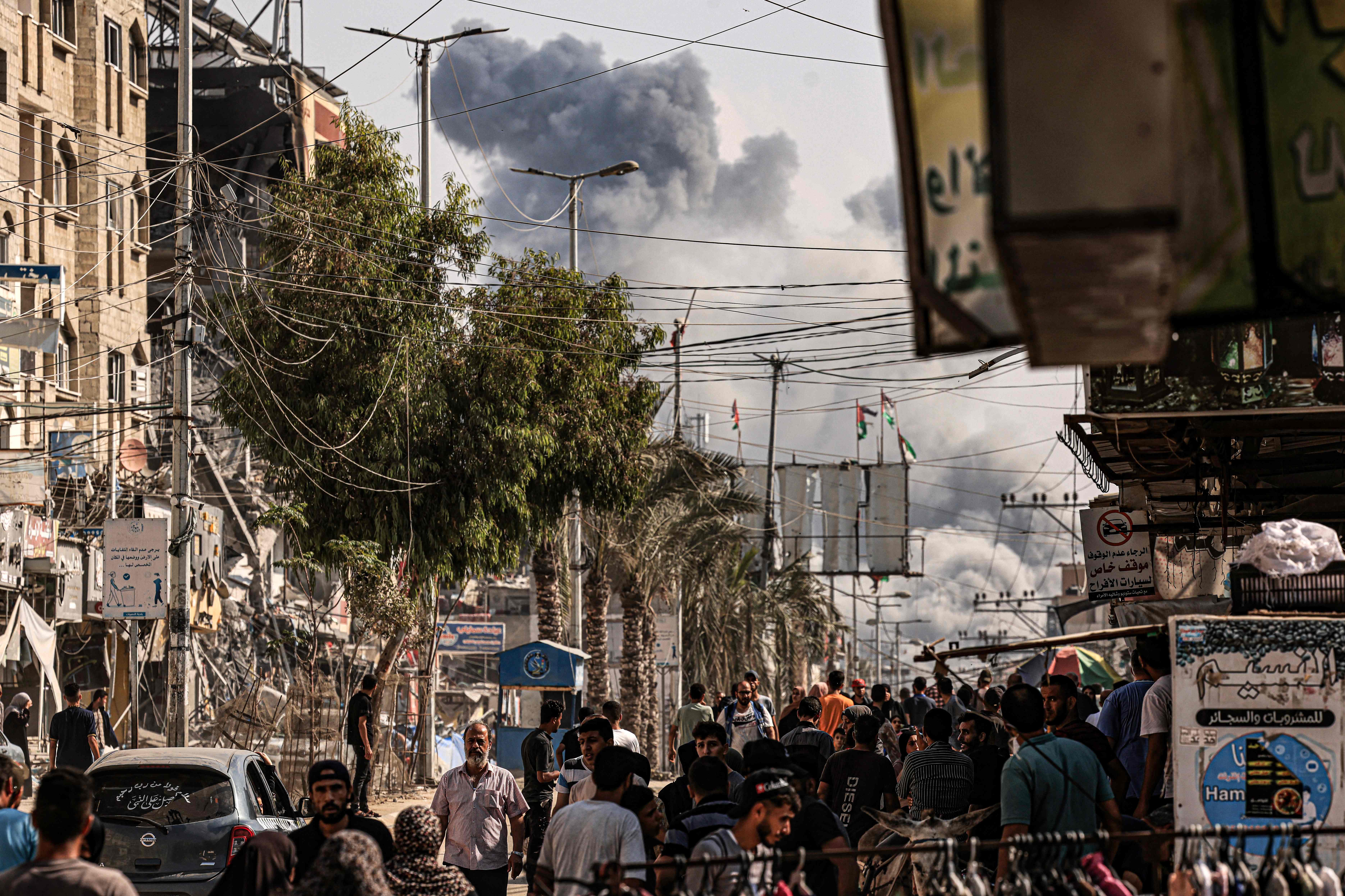 A plume of smoke rises during an Israeli strike on the Bureij refugee camp in the central Gaza Strip