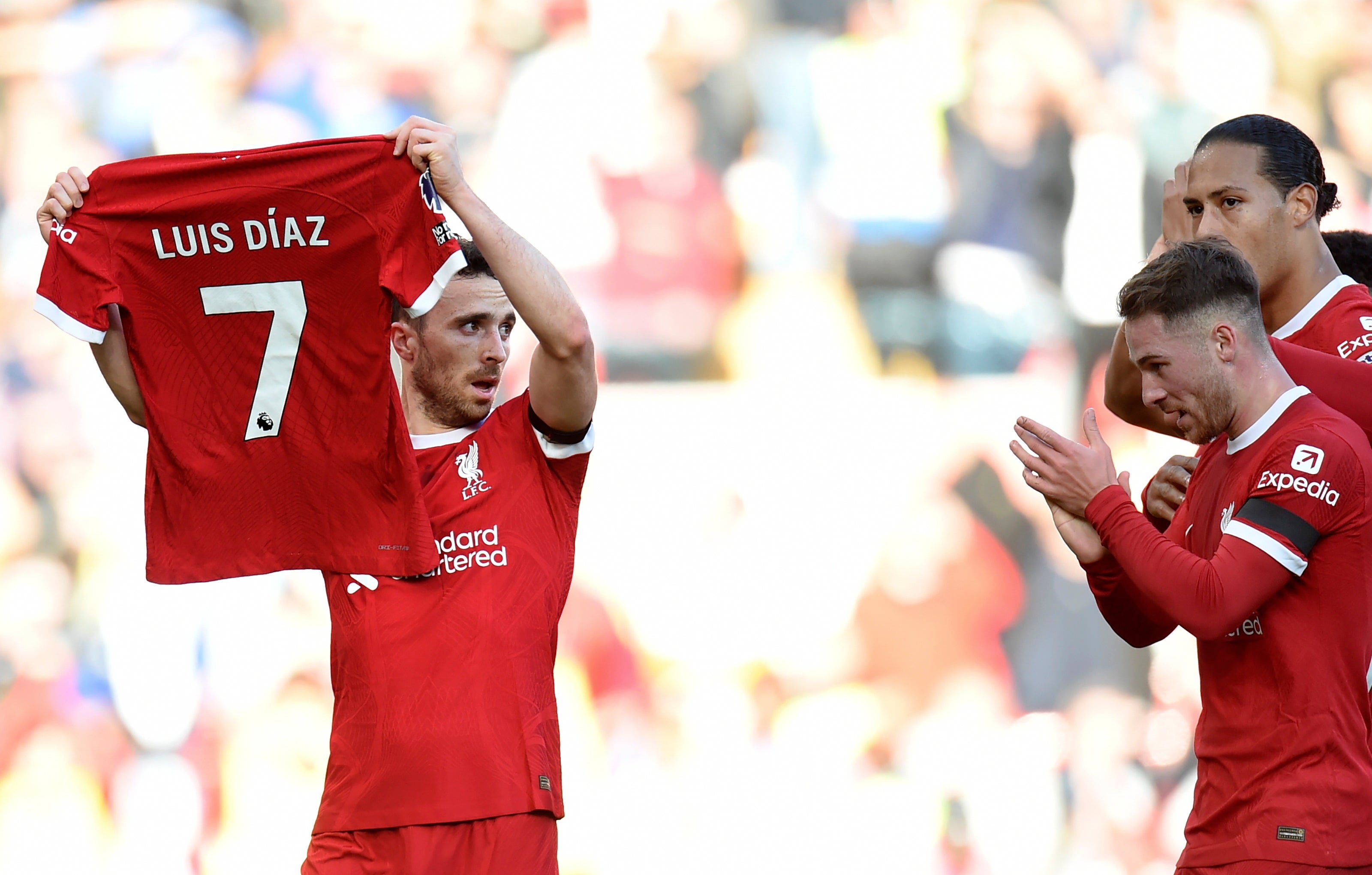 Touching tribute: Diogo Jota holds up the absent Diaz’s shirt during Liverpool’s match against Nottingham Forest last month