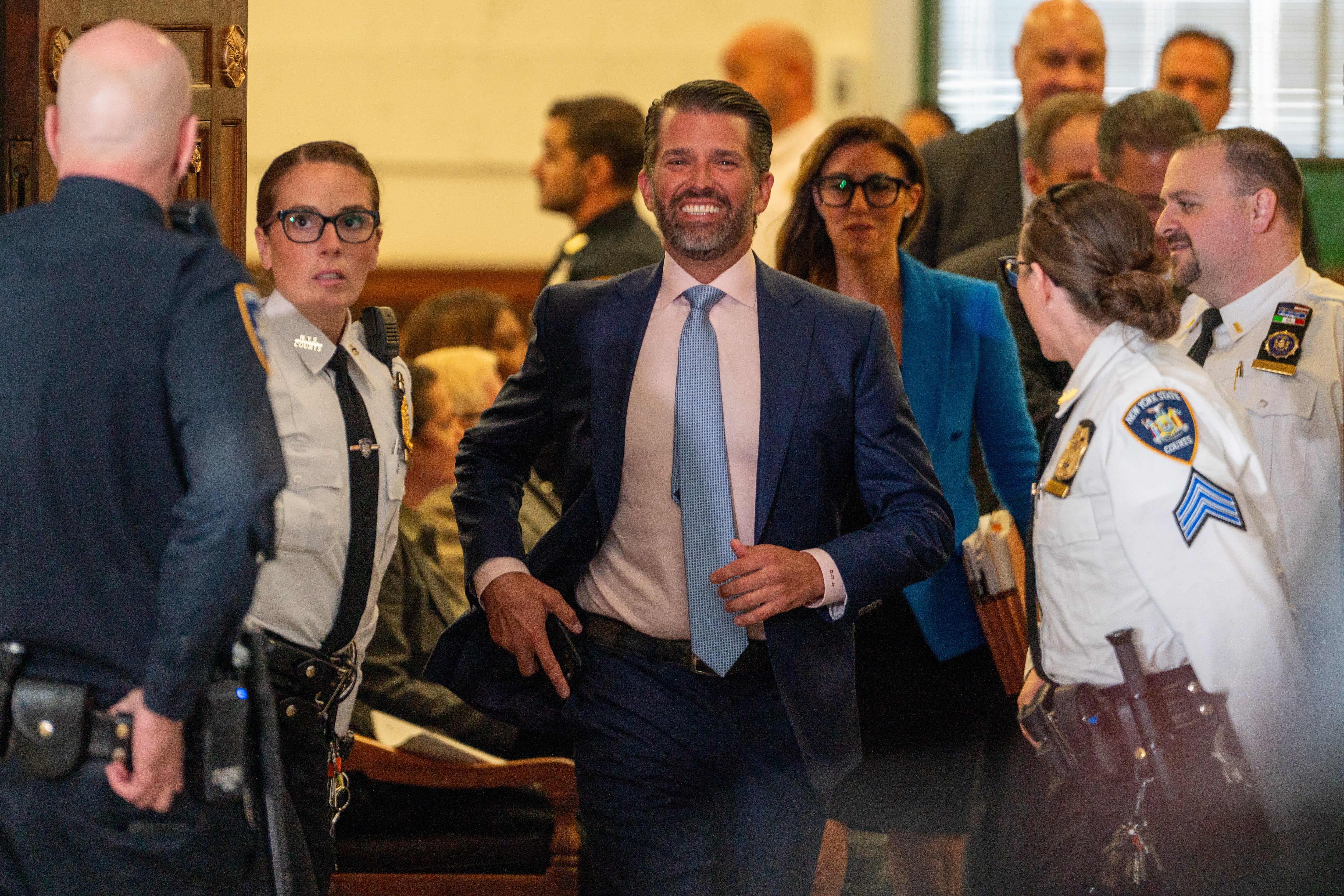 Donald Trump Jr smiles after his testimony in Judge Arthur Engoton’s courtroom on 2 November