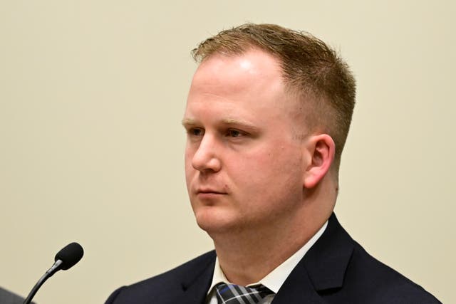 <p>FILE - Aurora, Colorado police officer Nathan Woodyard attends an arraignment hearing after being charged in the 2019 death of Elijah McClain, 20 January 2023</p>