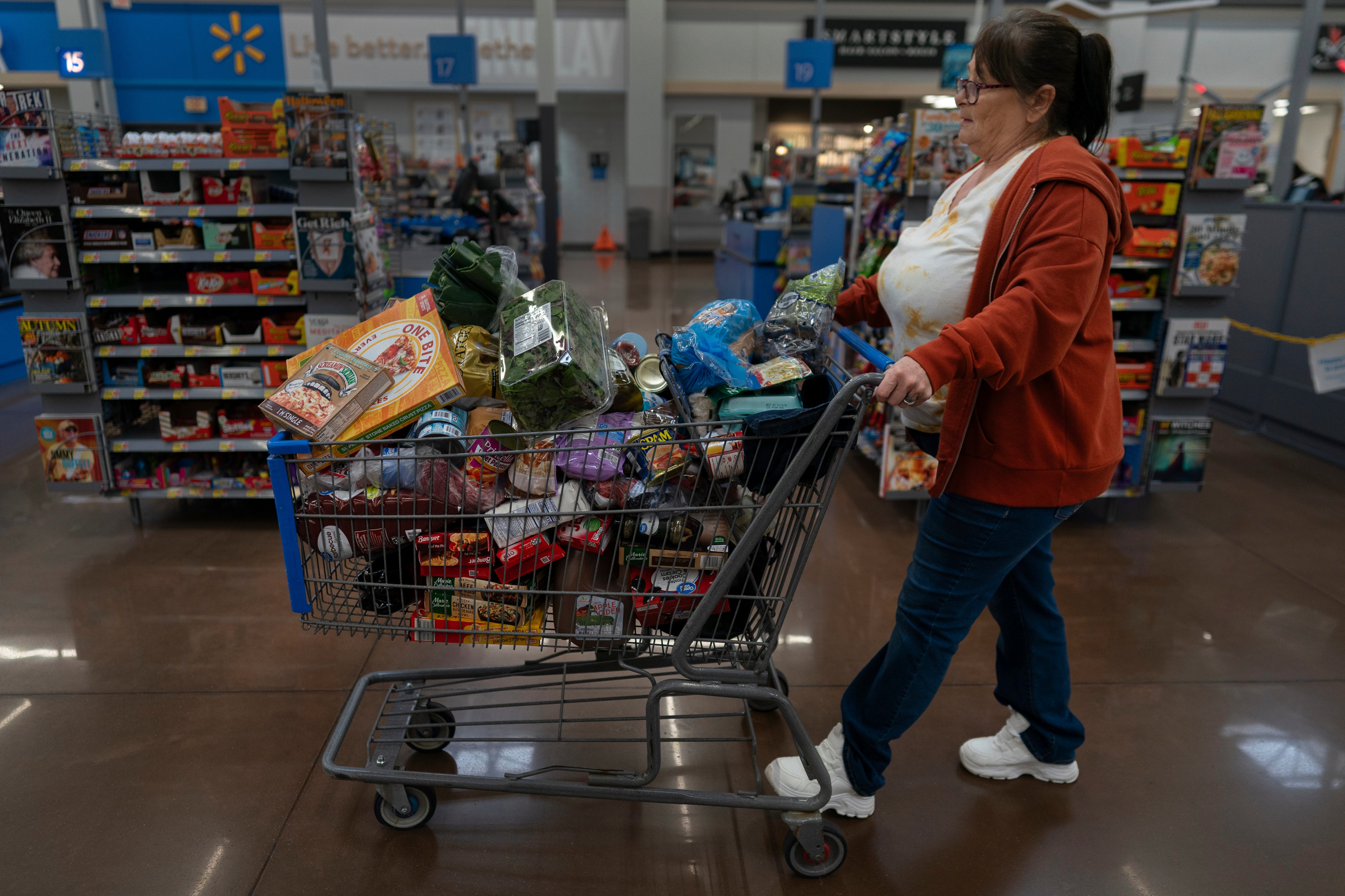 Jodi Ferdinandsen pushes her grocery cart through Walmart in Findlay, Ohio