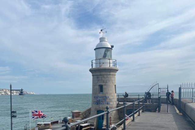 <p>The lighthouse at the end of the Folkestone Harbour Arm, an area that is being redeveloped </p>