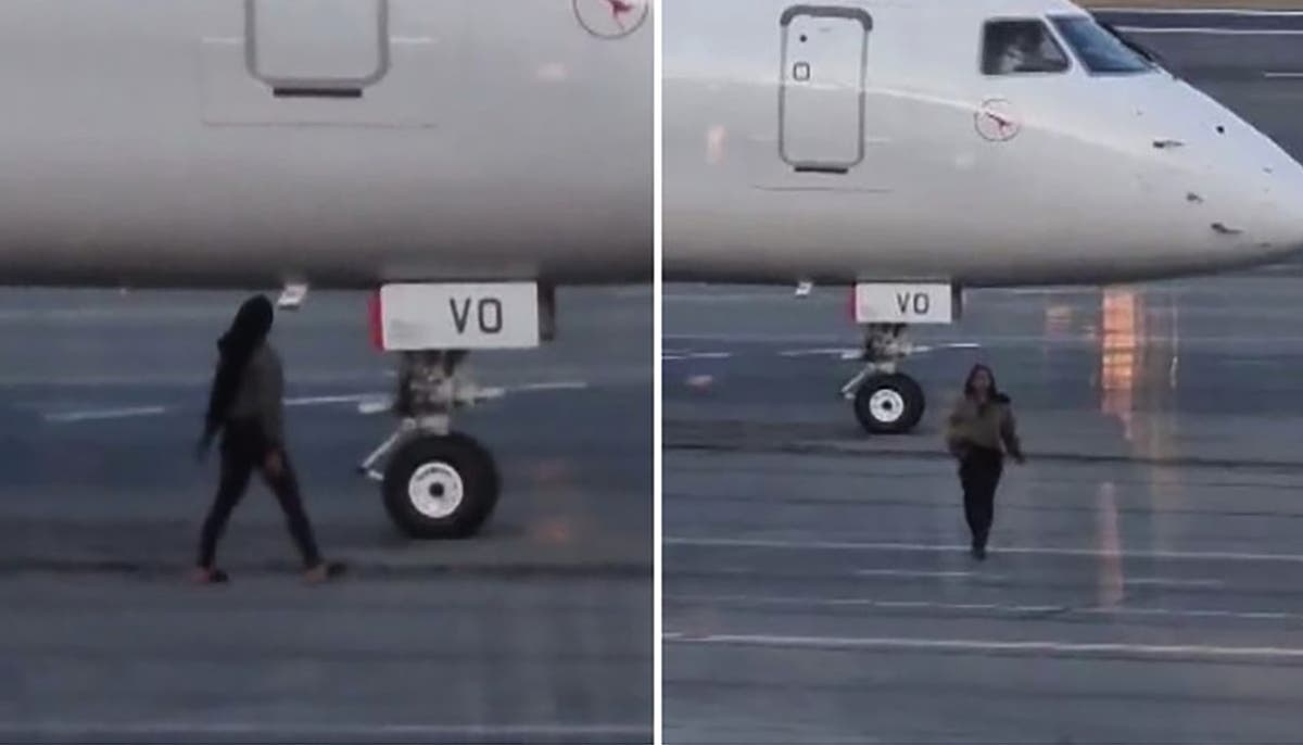 Woman arrested after running onto airport tarmac to flag down missed plane