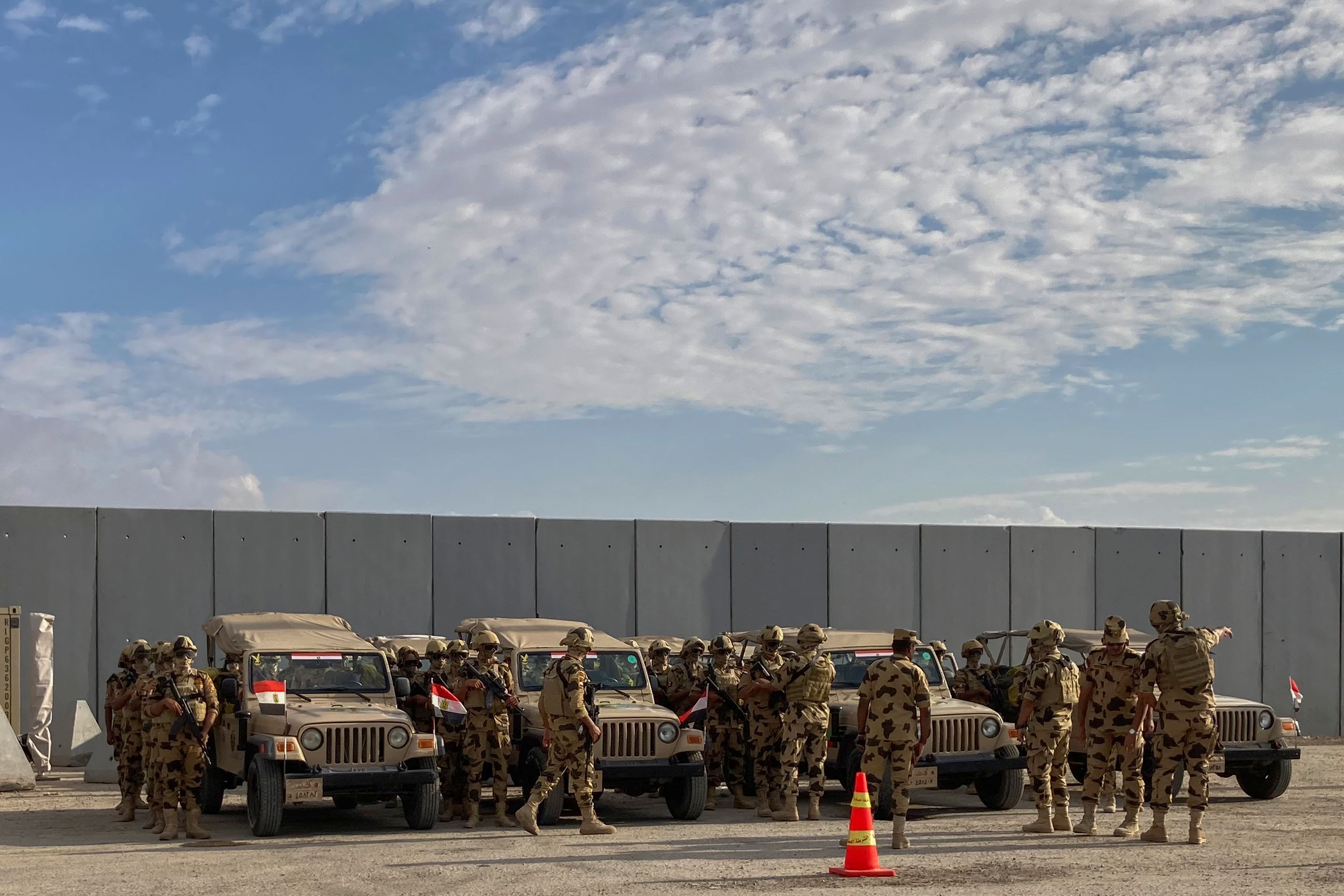 Military personnel stand alert at the Rafah border crossing between Egypt and the Gaza Strip