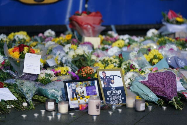 Lit candles among the flowers and messages left in tribute to Nottingham Panthers’ ice hockey player Adam Johnson outside the Motorpoint Arena in Nottingham, the home of the Panthers. Mr Johnson died after an accident during a Challenge Cup match with Sheffield Steelers on Saturday night. Picture date: Monday October 30, 2023.