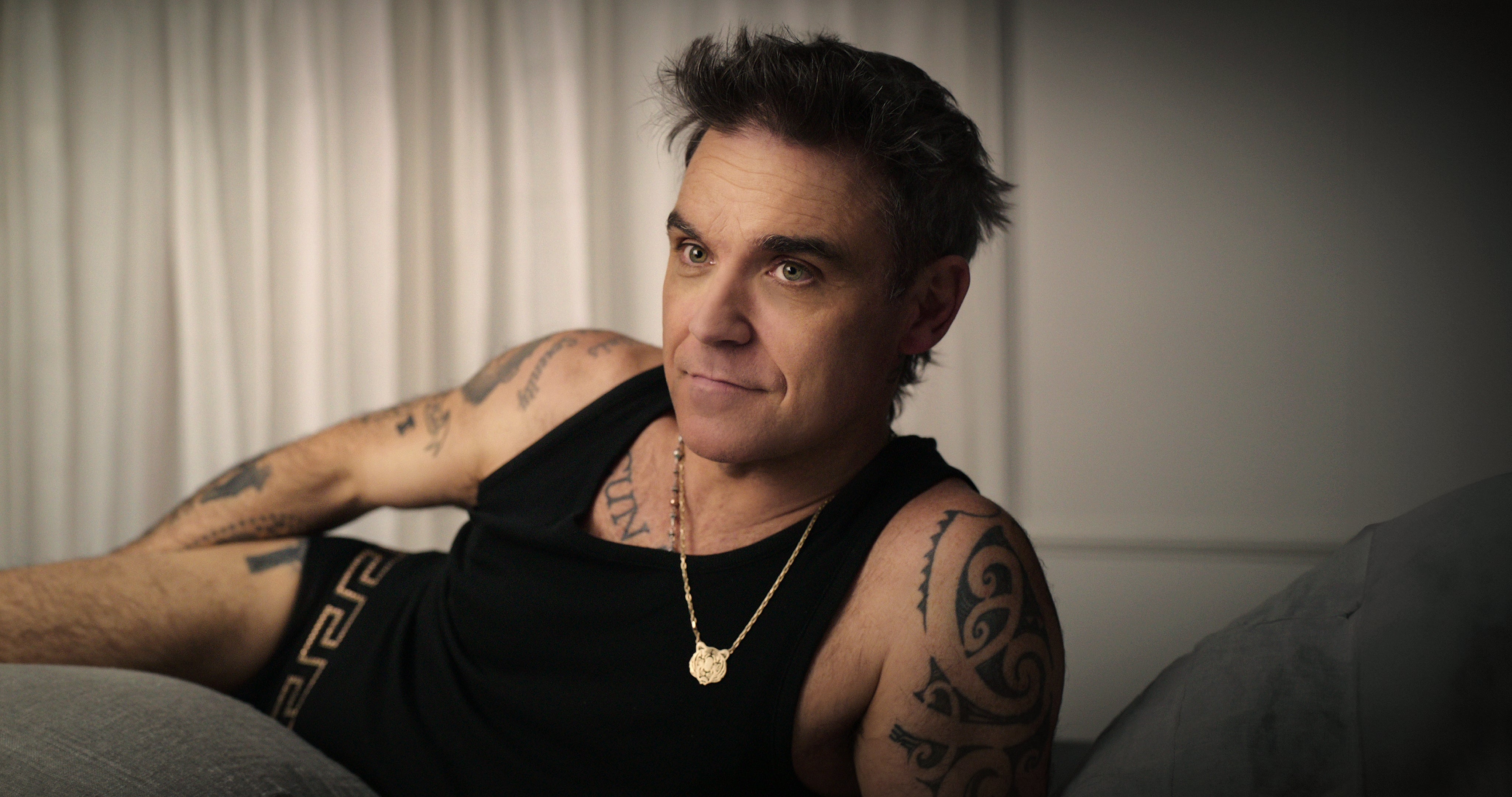 Robbie Williams looks back at his life in Joe Pearlman’s Netflix series