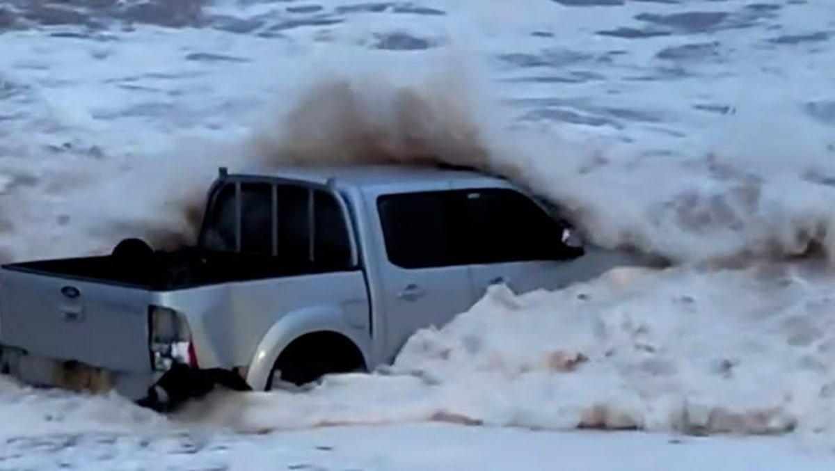 Sea spits mangled 4x4 truck out onto Devon beach amid fierce Storm Ciarán waves