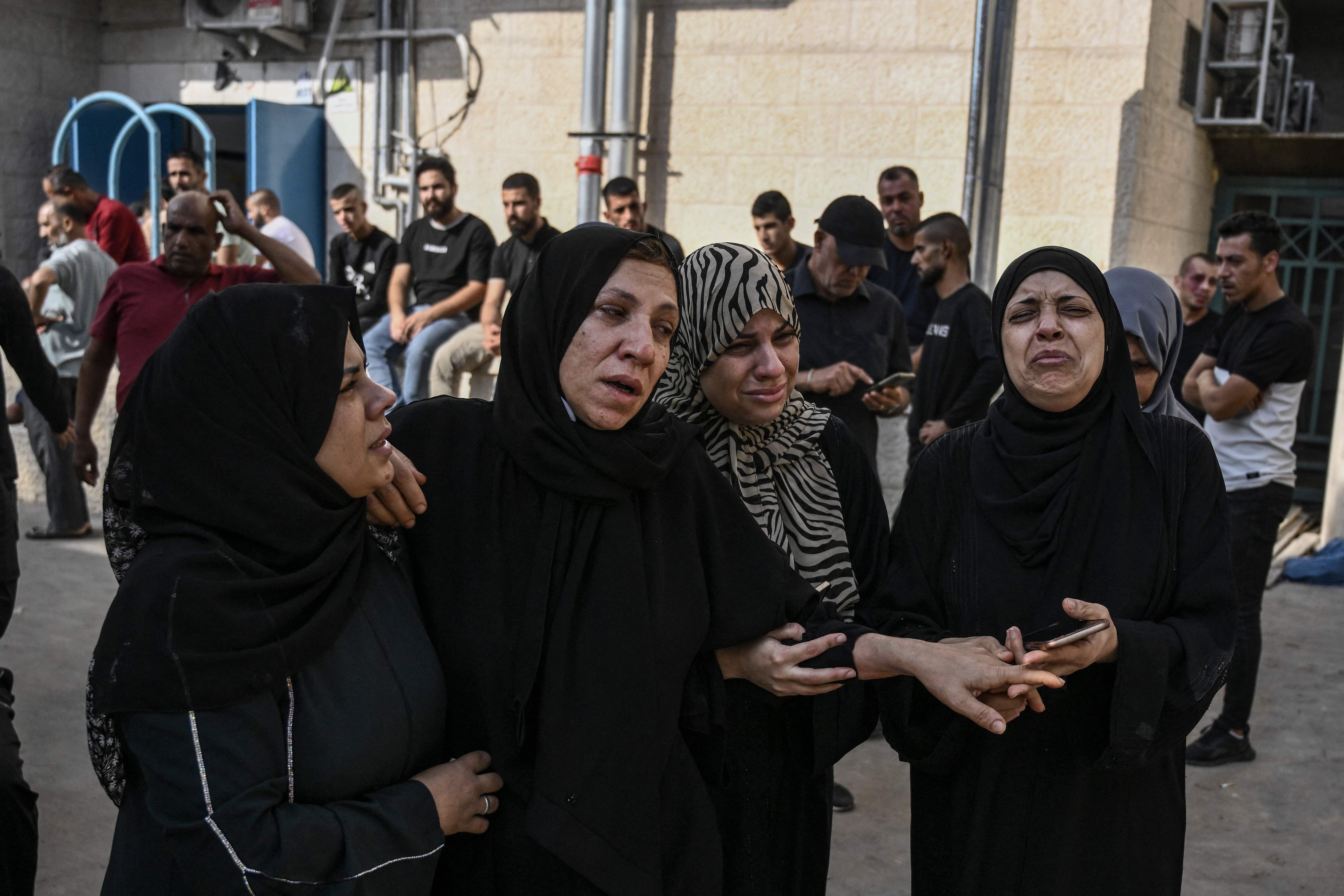 Palestinian relatives outside Jenin Hospital before a funeral of a man killed in the city