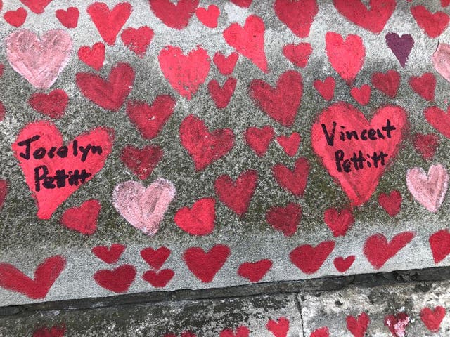 <p>Jane Roche paid tribute to her late father and sister by adding their hearts to the Covid-19 memorial wall in London</p>