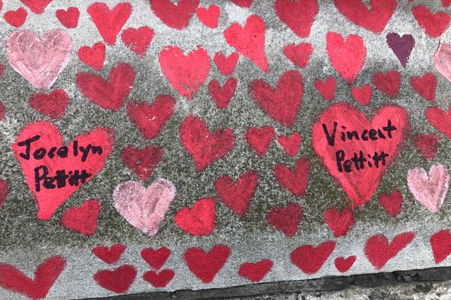 <p>Jane Roche paid tribute to her late father and sister by adding their hearts to the Covid-19 memorial wall in London</p>