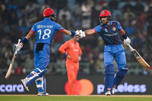 <p>Ibrahim Zadran congratulates Rahmat Shah, who scored 52 off 54 balls to set the platform for Afghanistan’s victory </p>