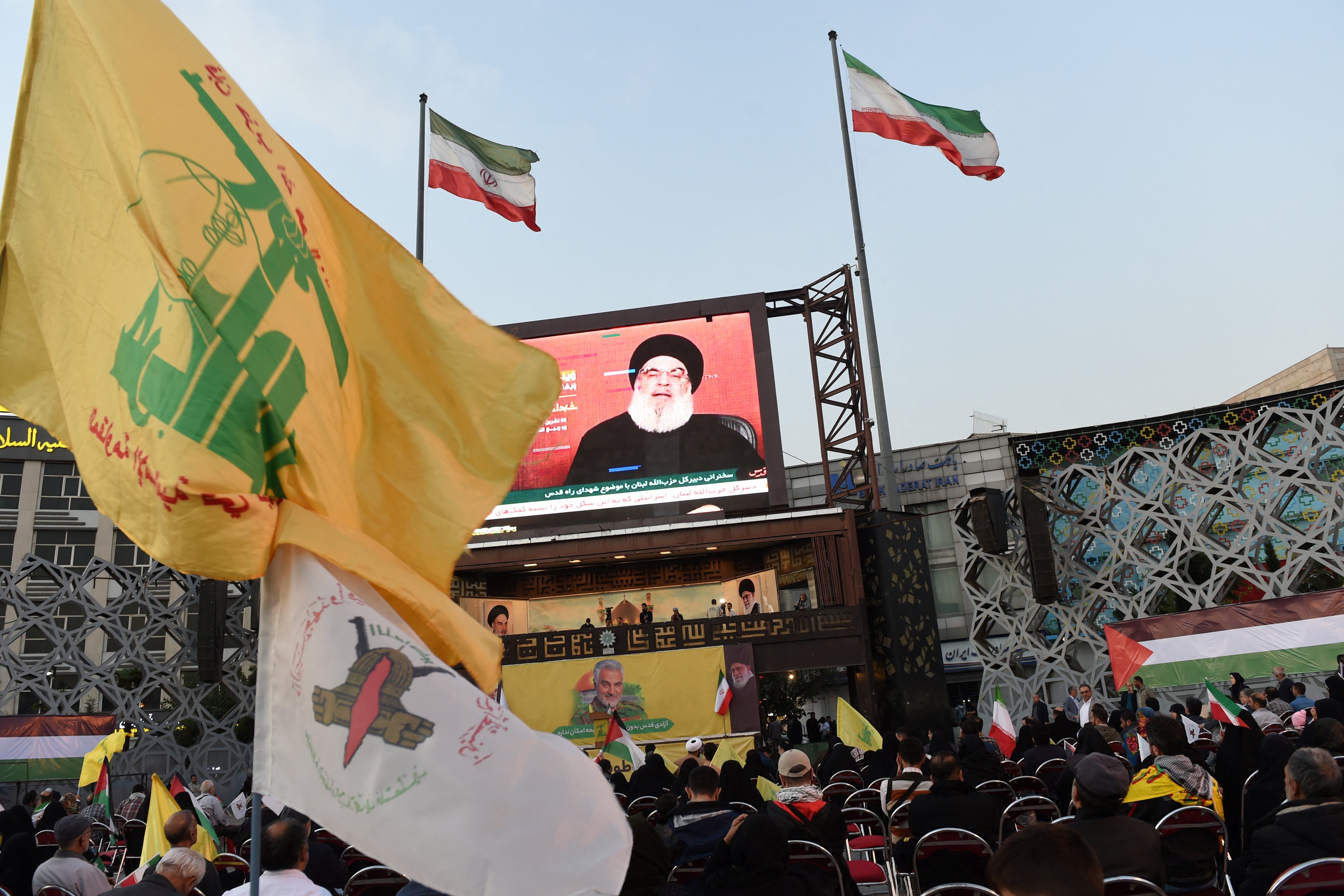 People in Tehran listen to Hezbollah leader Sayyed Hassan Nasrallah’s speech