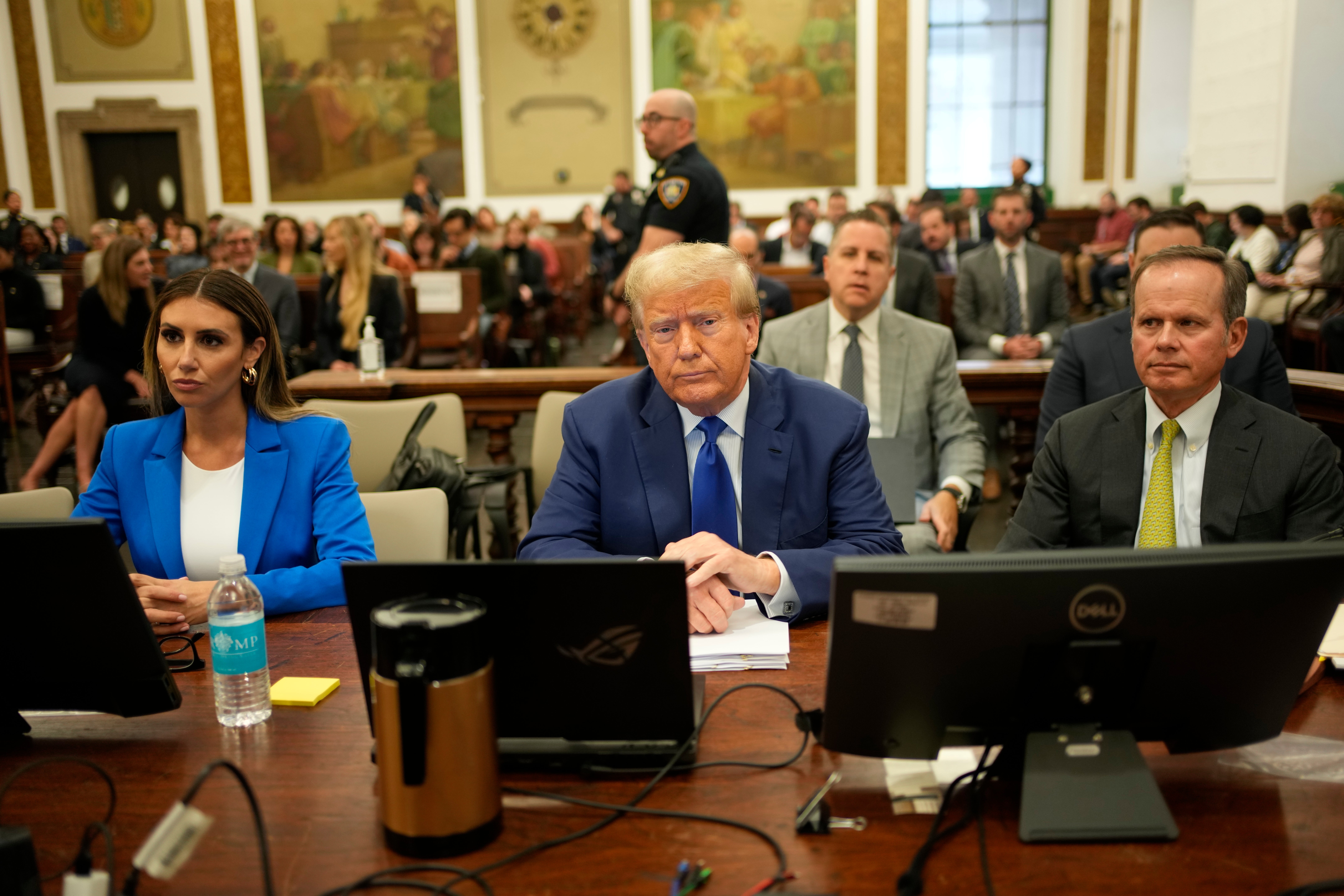 Donald Trump sits with his attorneys Alina Habba, left, and Christopher Kise, right, in New York Supreme Court on 25 October.