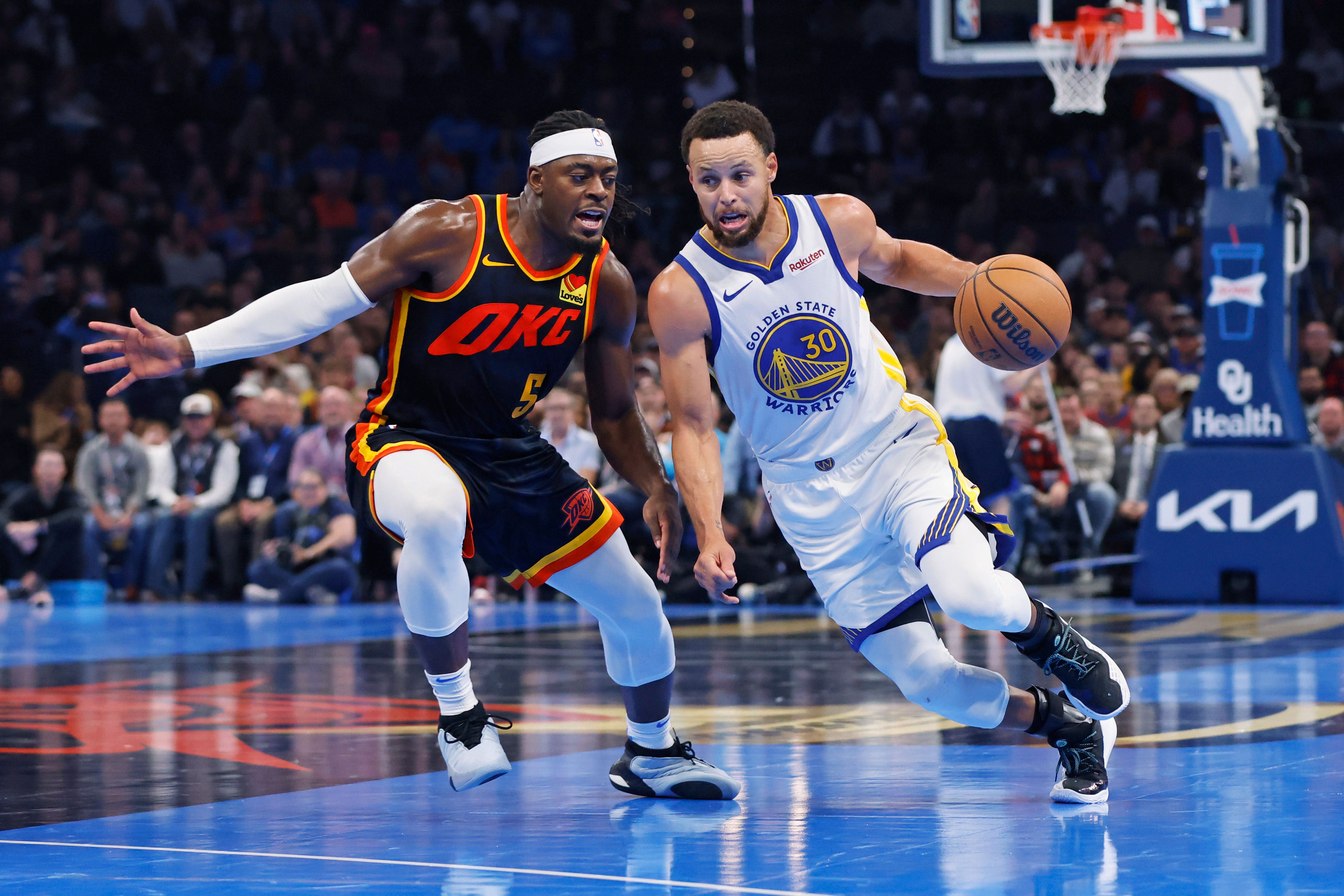 Golden State Warriors guard Steph Curry (30) drives as Oklahoma City Thunder guard Luguentz Dort (5) defends (Nate Billings/AP)