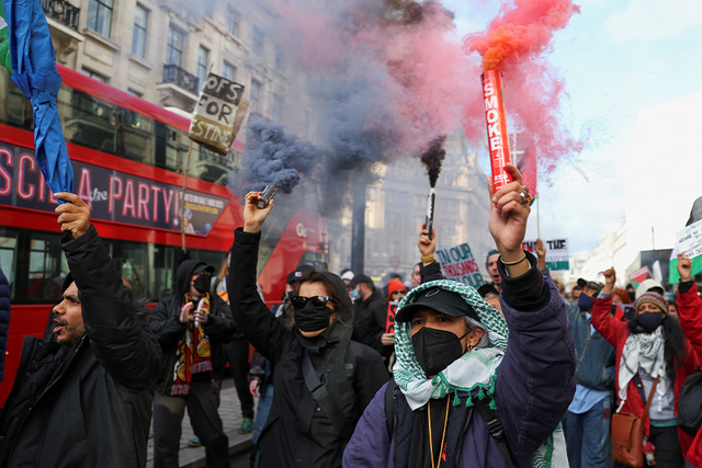 <p>Pro-Palestine demonstrators march through central London</p>