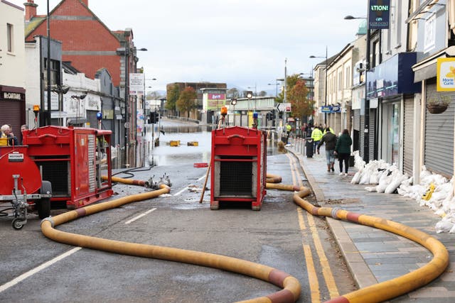Northern Ireland Fire and Rescue Service continue to pump water from flooded premises in Downpatrick town centre. Picture date: Saturday November 4, 2023.