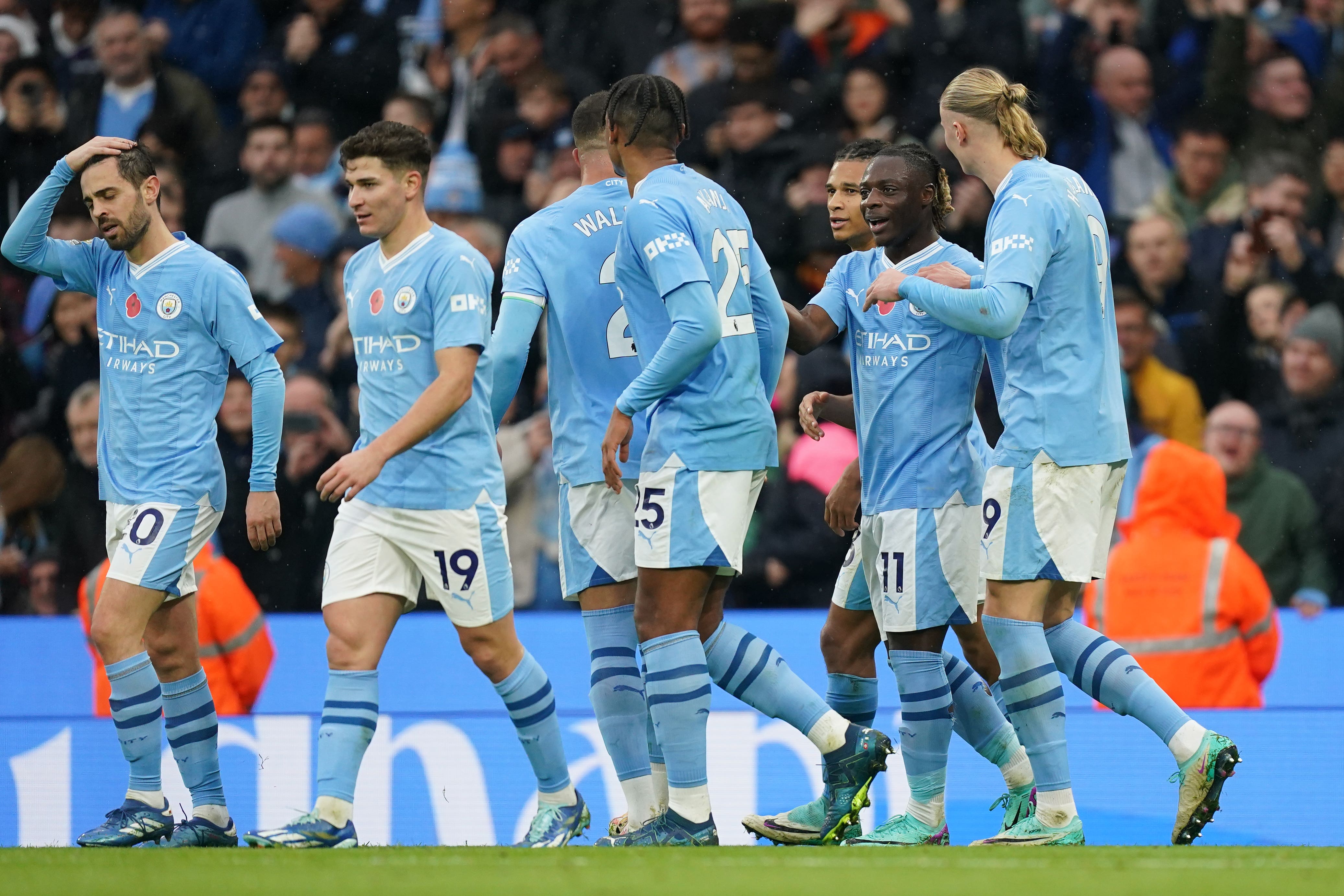 Manchester City’s Jeremy Doku (second right) celebrates scoring their side’s third goal (Mike Egerton/PA)
