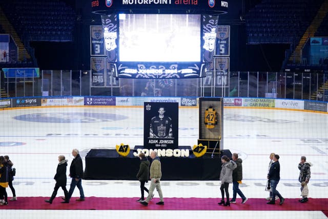 People queue to sign a book of condolence as they attend a memorial for Nottingham Panthers ice hockey player Adam Johnson at the Motorpoint Arena, Nottingham (Zac Goodwin/PA).