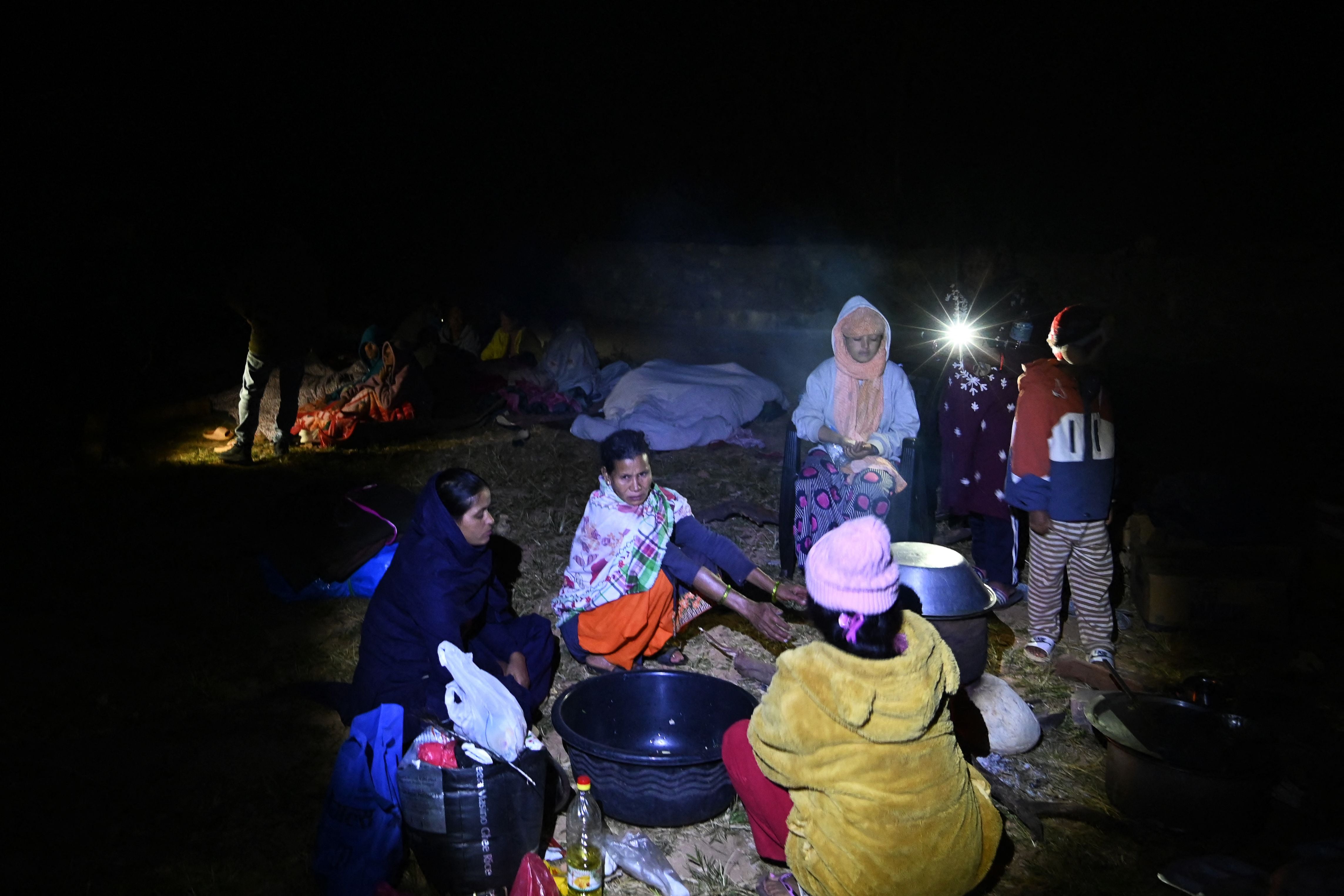 Residents gather at an open air area in Jajarkot district