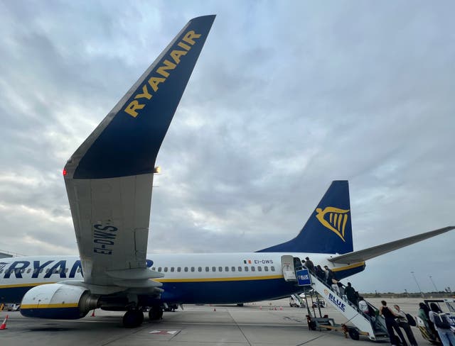 <p>Boarding now: passengers boarded Ryanair flights at an average rate of 400 per minute during the summer</p>