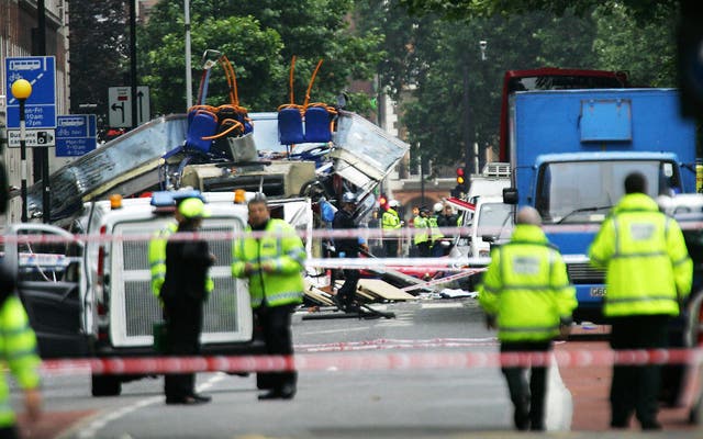<p>The destroyed bus at Tavistock Square after a suicide bomber killed 13 people </p>