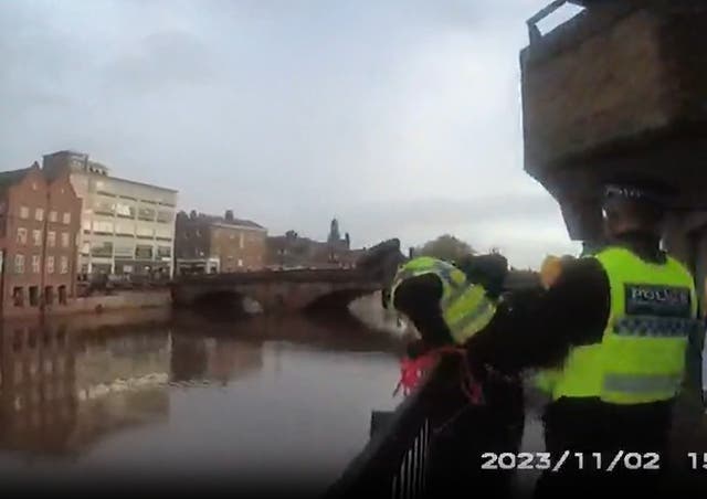 <p>Police at the River Ouse carrying out a rescue of the man who was drowning</p>