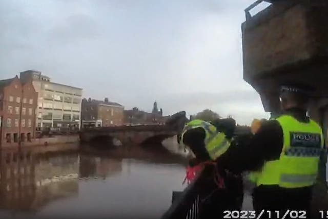 <p>Police at the River Ouse carrying out a rescue of the man who was drowning</p>