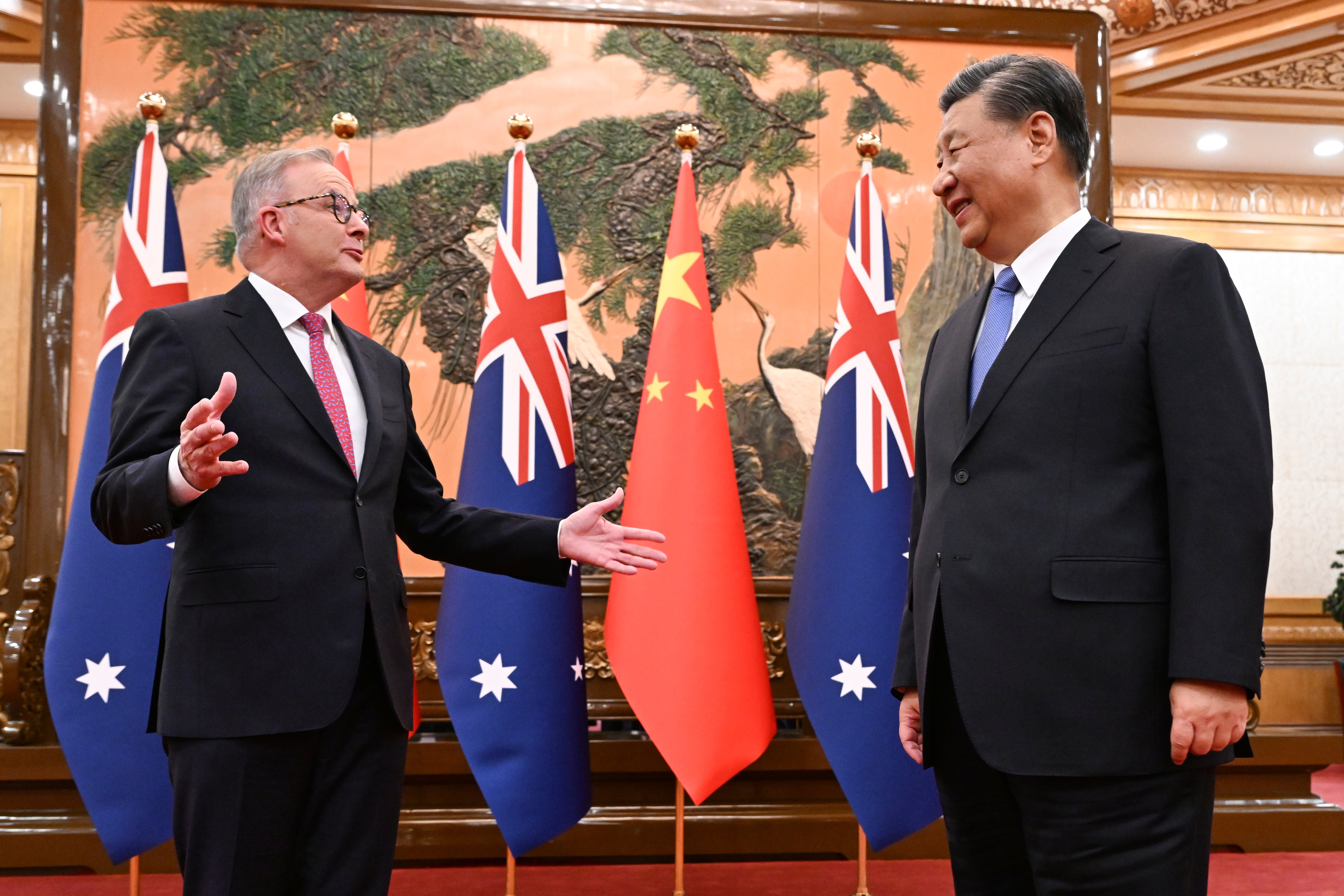Australia's Prime Minister Anthony Albanese, left, gestures as he meets with China's President Xi Jinping at the Great Hall of the People in Beijing