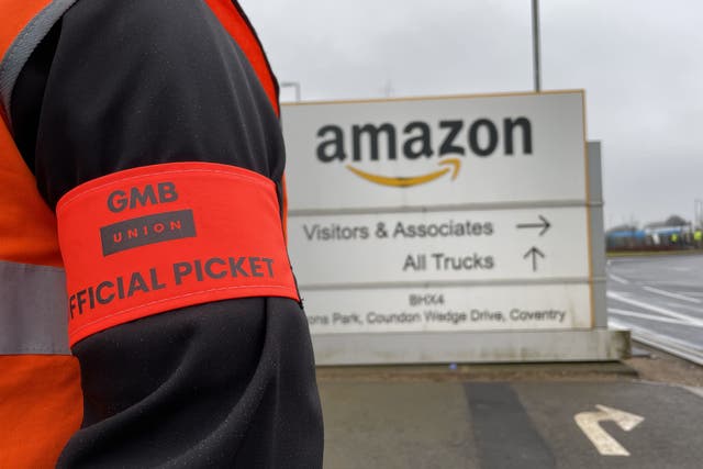 Members of the GMB union on the picket line outside the Amazon fulfilment centre in Coventry earlier in the year (Phil Barnett/PA)