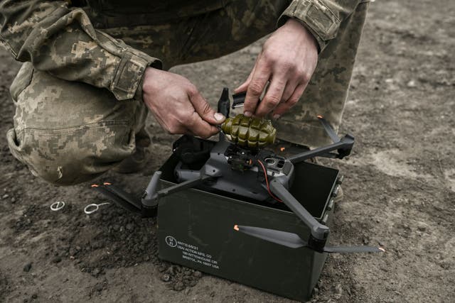 <p>Representational image: A Ukrainian serviceman attaches a hand grenade on a drone to use in an attack, near Bakhmut</p>